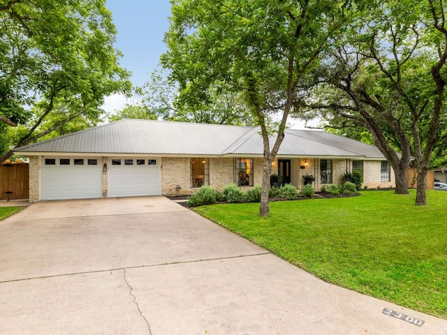 2300 Toulouse Dr, Austin, TX 78748 - single story home featuring a garage, concrete driveway, a front yard, and brick siding