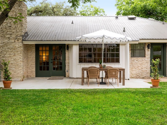 2300 Toulouse Dr, Austin, TX 78748 - back of property with a patio area, a yard, french doors, a chimney, and metal roof