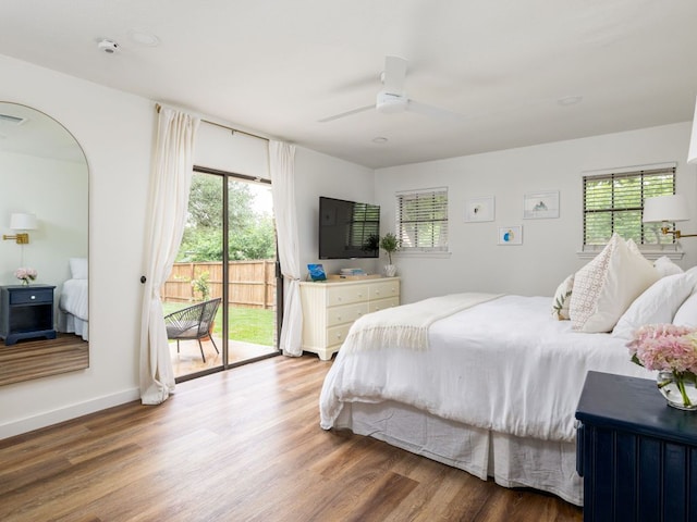 2300 Toulouse Dr, Austin, TX 78748 - bedroom featuring access to exterior, multiple windows, wood finished floors, and ceiling fan