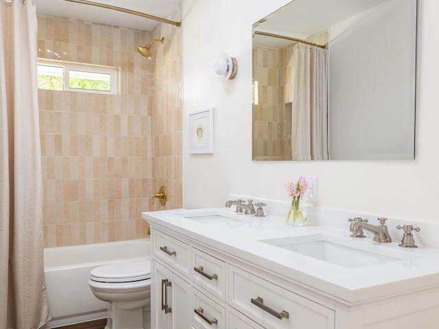 2300 Toulouse Dr, Austin, TX 78748 - bathroom with double vanity, shower / bathtub combination with curtain, and toilet