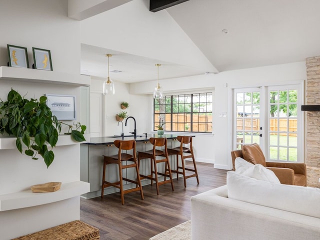 2300 Toulouse Dr, Austin, TX 78748 - living area with high vaulted ceiling, dark wood-style floors, beam ceiling, and baseboards