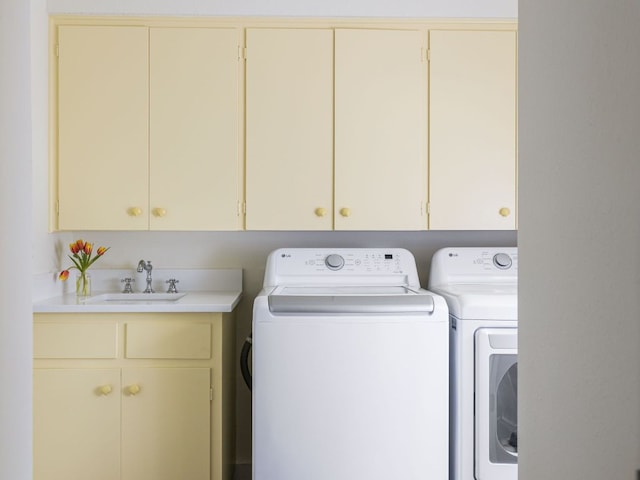 laundry area with cabinet space and washing machine and dryer