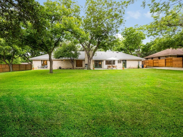 2300 Toulouse Dr, Austin, TX 78748 - rear view of house featuring brick siding