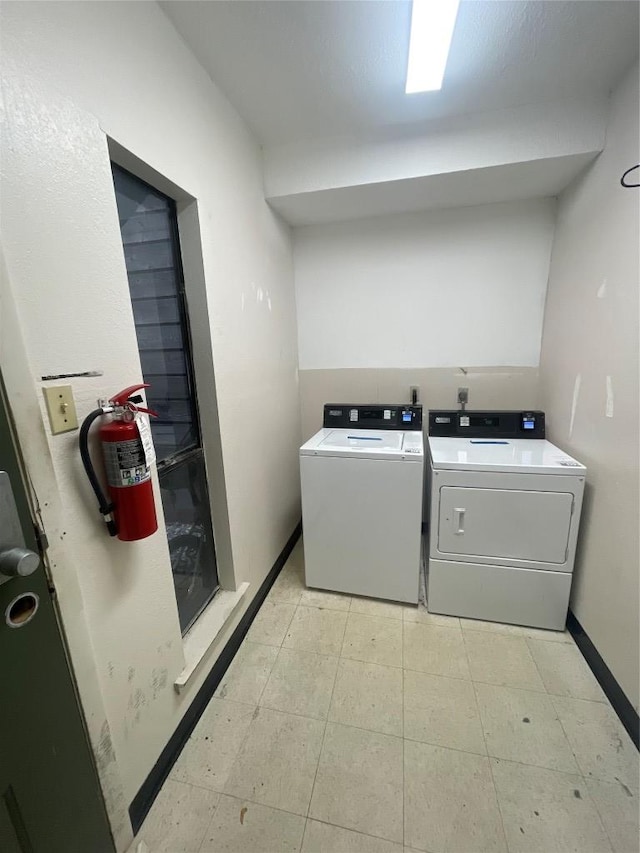 4701 Red River St Unit 104, Austin, TX 78751 - laundry room with washer and clothes dryer and baseboards