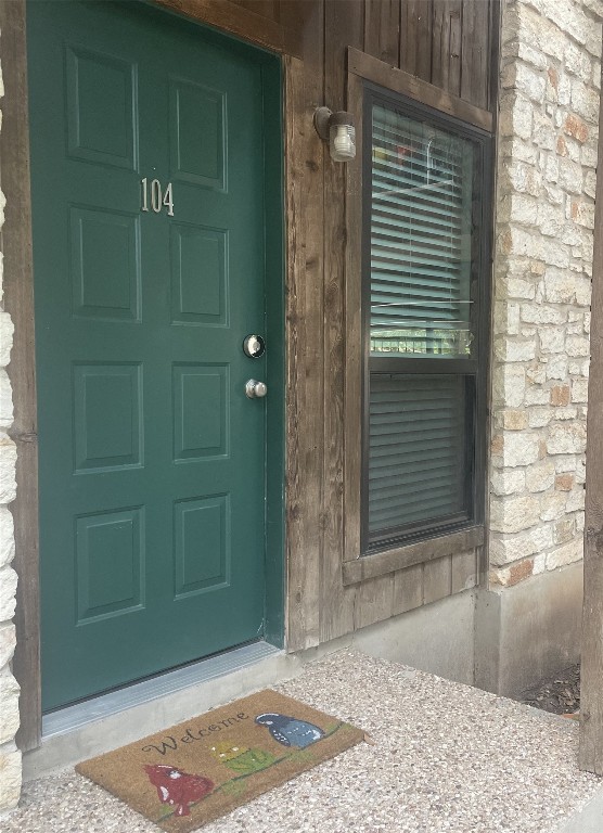 4701 Red River St Unit 104, Austin, TX 78751 - property entrance with stone siding