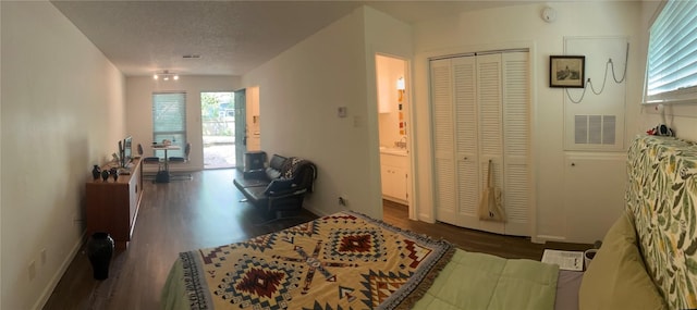 4701 Red River St Unit 104, Austin, TX 78751 - hallway featuring wood finished floors and a textured ceiling