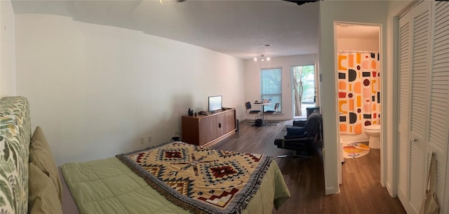 4701 Red River St Unit 104, Austin, TX 78751 - bedroom with dark wood-style flooring