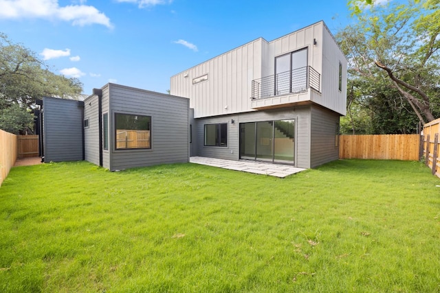 4407 Merle Dr Unit B, Austin, TX 78645 - rear view of property with a balcony, board and batten siding, and a patio
