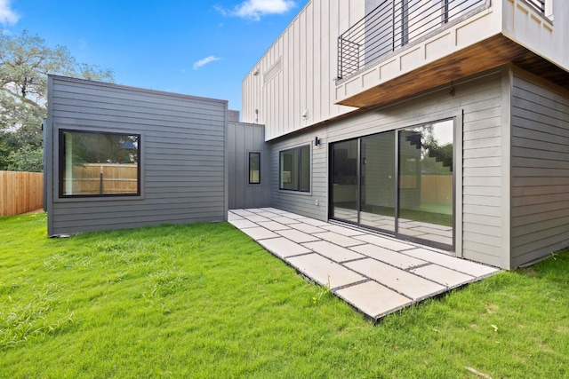 4407 Merle Dr Unit B, Austin, TX 78645 - rear view of house with board and batten siding and a patio area