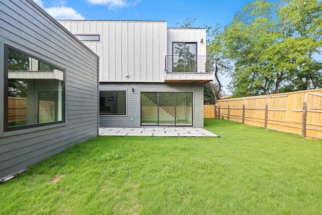 4407 Merle Dr Unit B, Austin, TX 78645 - rear view of property featuring a balcony, board and batten siding, and a patio