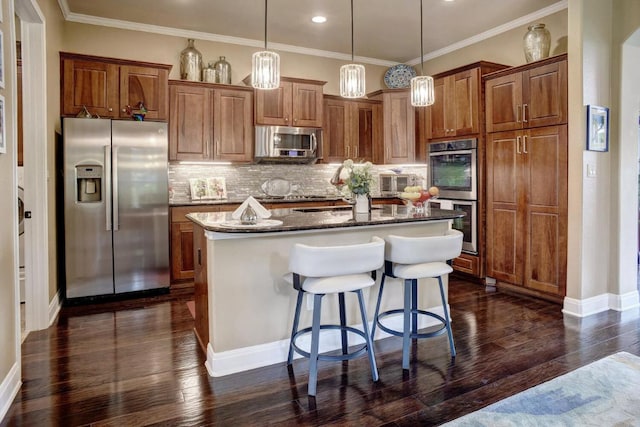 15208 Origins Ln, Austin, TX 78734 - kitchen with appliances with stainless steel finishes, a kitchen island, brown cabinetry, decorative backsplash, and crown molding