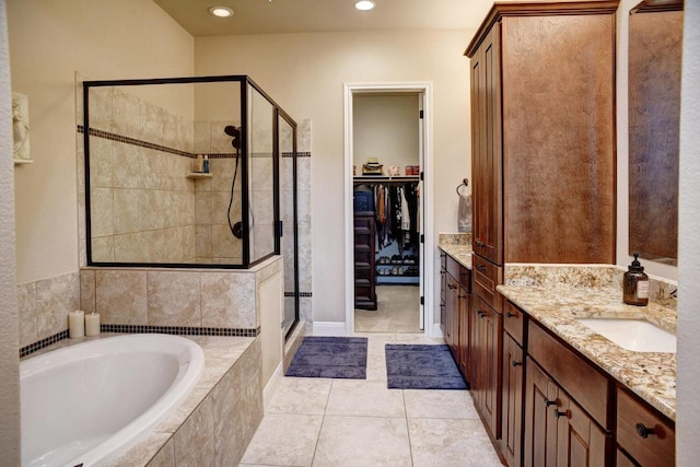 15208 Origins Ln, Austin, TX 78734 - bathroom with a shower stall, a bath, vanity, a walk in closet, and recessed lighting