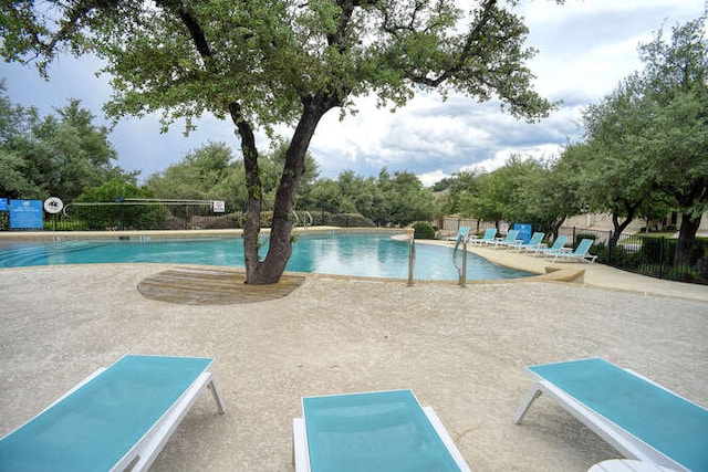 15208 Origins Ln, Austin, TX 78734 - community pool with fence and a patio