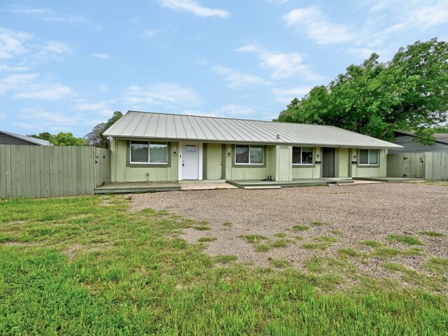 5207 Tahoe Trl Unit A, B, C, & D, Austin, TX 78745 - ranch-style home with covered porch and metal roof