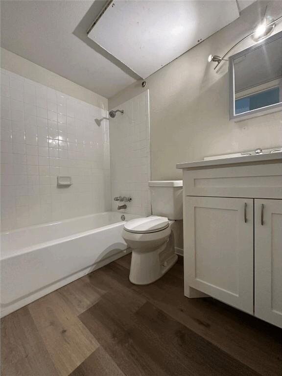 5207 Tahoe Trl Unit A, B, C, & D, Austin, TX 78745 - bathroom with wood finished floors, toilet, shower / bath combination, and vanity