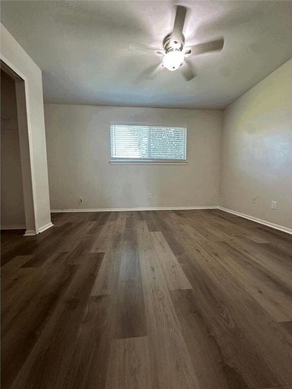 5207 Tahoe Trl Unit A, B, C, & D, Austin, TX 78745 - spare room with baseboards, dark wood-style floors, and ceiling fan