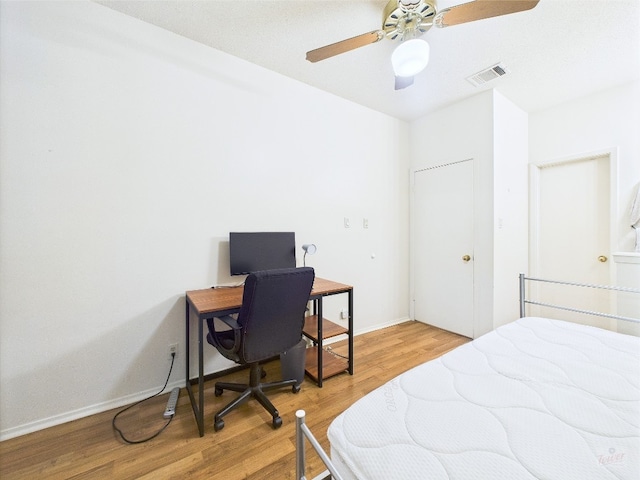 2905 Swisher St Unit 205, Austin, TX 78705 - bedroom with light wood-style floors, baseboards, and ceiling fan