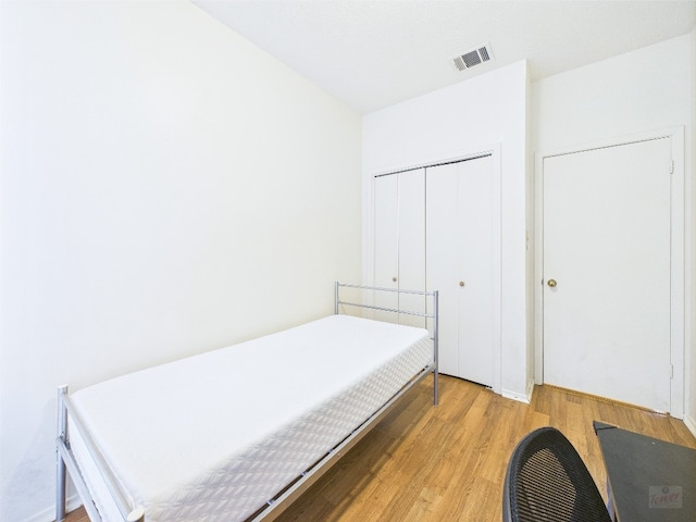 2905 Swisher St Unit 205, Austin, TX 78705 - bedroom featuring light wood-type flooring and a closet