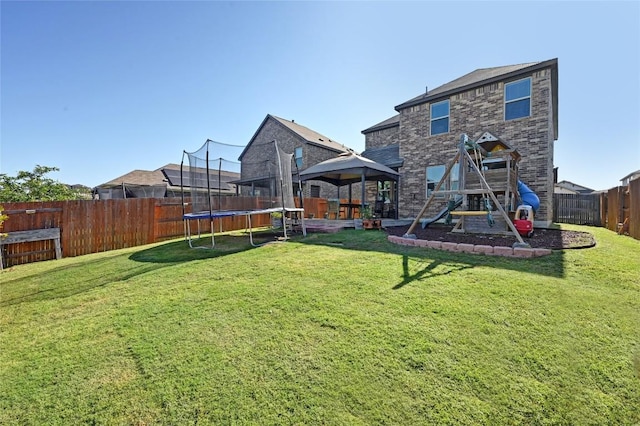 160 Thornless Cir, Buda, TX 78610 - view of yard with a trampoline, a gazebo, and a playground
