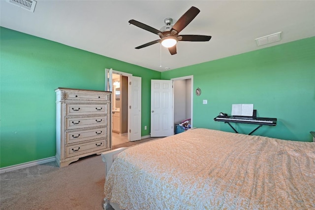 160 Thornless Cir, Buda, TX 78610 - carpeted bedroom featuring baseboards, ceiling fan, and ensuite bathroom