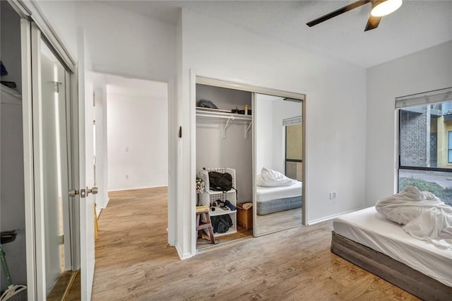 806 W 24th St Unit 114, Austin, TX 78705 - bedroom with wood finished floors, a closet, ceiling fan, and baseboards