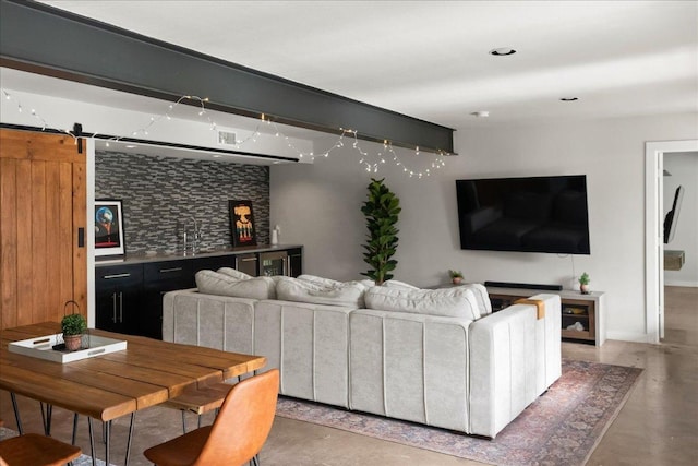 909 Electra, Lakeway, TX 78734 - living area with finished concrete flooring and beverage cooler
