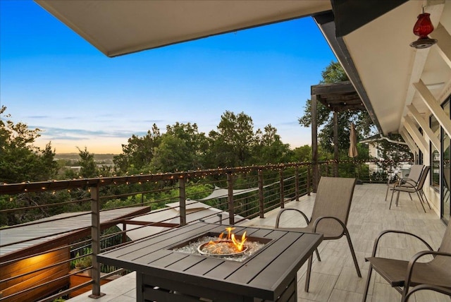 909 Electra, Lakeway, TX 78734 - balcony at dusk with an outdoor fire pit