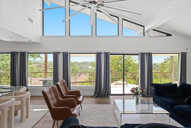 909 Electra, Lakeway, TX 78734 - living area featuring beam ceiling, plenty of natural light, high vaulted ceiling, and wood finished floors