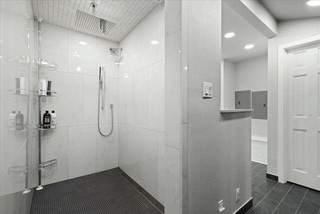 909 Electra, Lakeway, TX 78734 - bathroom with a tile shower, recessed lighting, and tile patterned floors