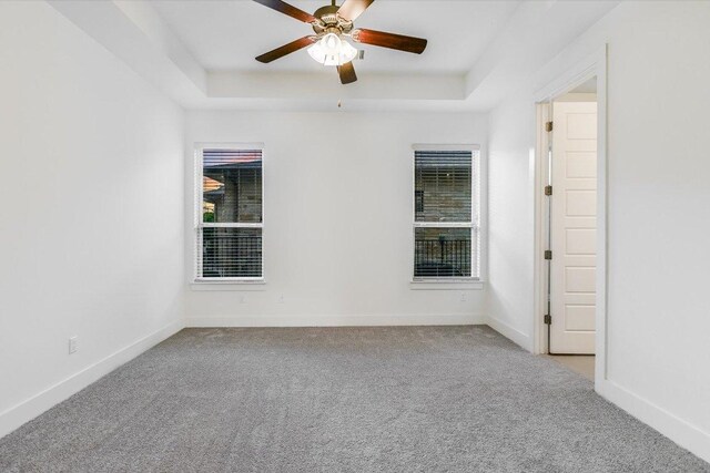301 Jeffrey David Ln W, Austin, TX 78717 - spare room with a raised ceiling, carpet, and a ceiling fan