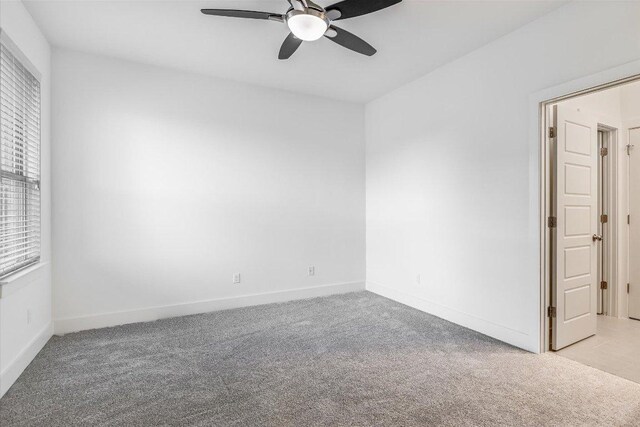301 Jeffrey David Ln W, Austin, TX 78717 - empty room featuring light carpet, ceiling fan, and baseboards
