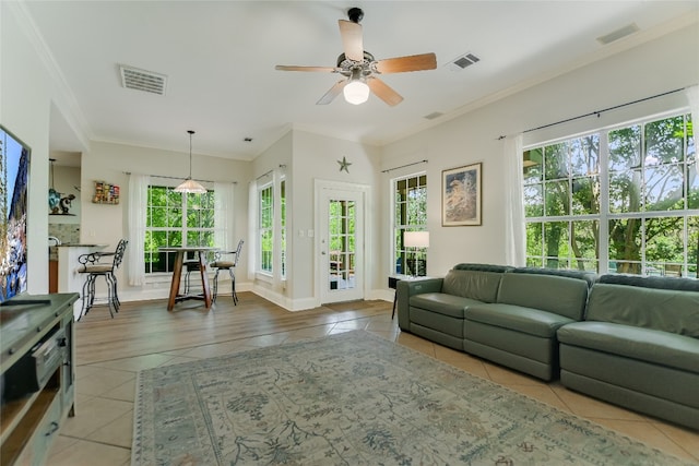 108 Tumbleweed Trl, Austin, TX 78733 - living area featuring light tile patterned floors, ceiling fan, ornamental molding, and baseboards