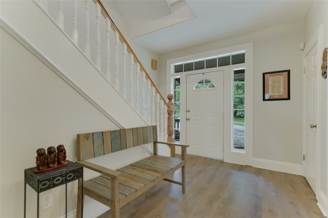 108 Tumbleweed Trl, Austin, TX 78733 - foyer entrance featuring stairway, wood finished floors, and baseboards
