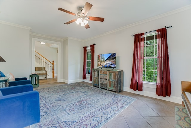 108 Tumbleweed Trl, Austin, TX 78733 - living area with stairway, a ceiling fan, crown molding, baseboards, and tile patterned flooring