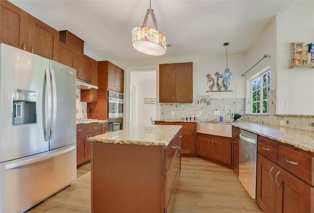 108 Tumbleweed Trl, Austin, TX 78733 - kitchen with appliances with stainless steel finishes, a sink, backsplash, and a kitchen island