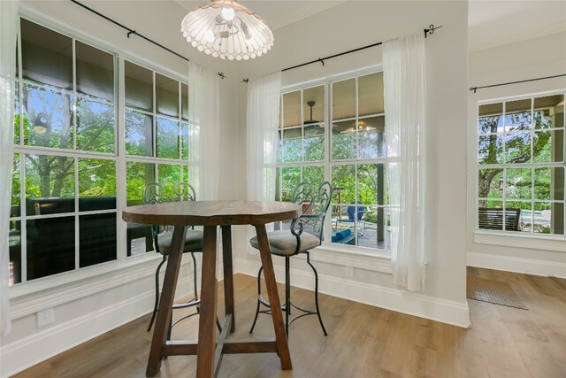 108 Tumbleweed Trl, Austin, TX 78733 - dining space with wood finished floors, baseboards, and a chandelier