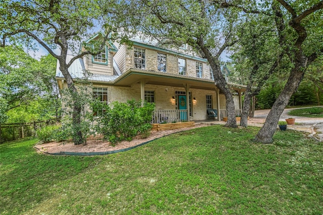 108 Tumbleweed Trl, Austin, TX 78733 - view of front of property with a porch and a front lawn