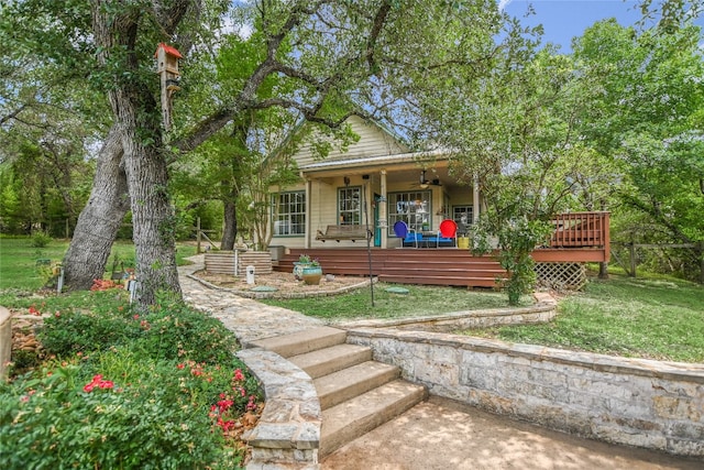 108 Tumbleweed Trl, Austin, TX 78733 - bungalow-style home featuring a ceiling fan, a front lawn, and a wooden deck
