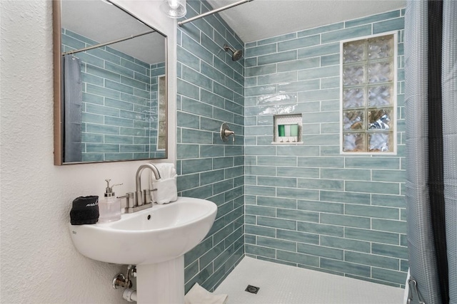 2106 Kenwood Ave, Austin, TX 78704 - bathroom with tiled shower and a textured wall