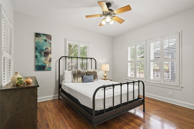2106 Kenwood Ave, Austin, TX 78704 - bedroom with multiple windows, baseboards, wood finished floors, and ceiling fan