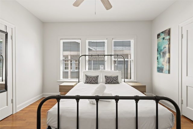 2106 Kenwood Ave, Austin, TX 78704 - bedroom with multiple windows, light wood-style flooring, baseboards, and ceiling fan