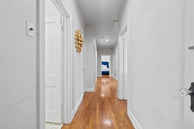 2106 Kenwood Ave, Austin, TX 78704 - corridor featuring attic access, light wood-style floors, and baseboards