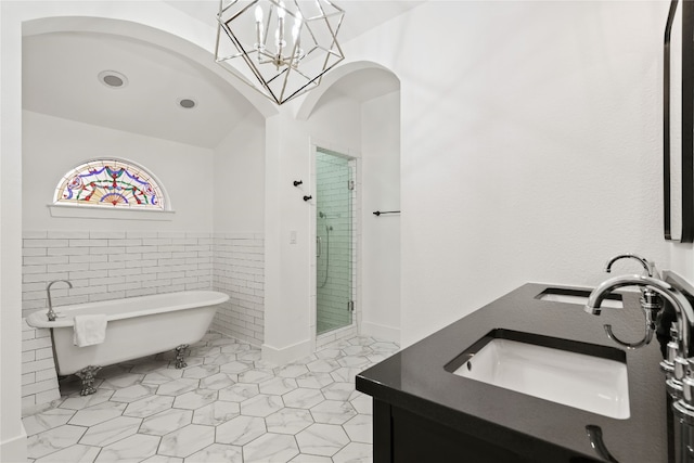 2106 Kenwood Ave, Austin, TX 78704 - full bath with double vanity, a freestanding tub, a stall shower, tile patterned flooring, and a chandelier