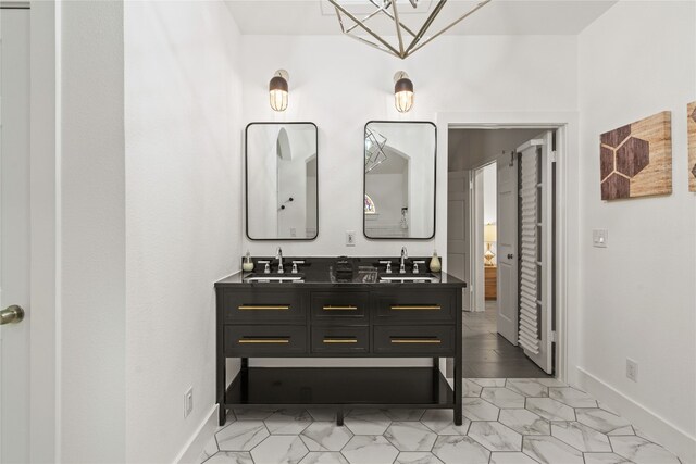 2106 Kenwood Ave, Austin, TX 78704 - bathroom featuring double vanity and baseboards