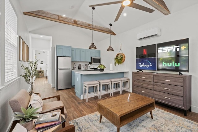 2106 Kenwood Ave, Austin, TX 78704 - living room with a wall mounted AC, beamed ceiling, ceiling fan, wood finished floors, and recessed lighting