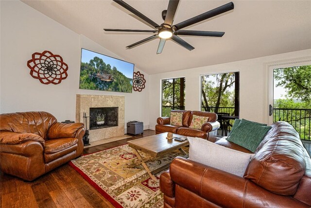3005 Brass Buttons Trl, Austin, TX 78734 - living area with ceiling fan, dark wood finished floors, a tiled fireplace, and high vaulted ceiling