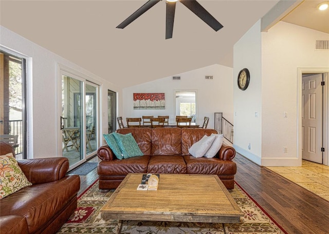 living area featuring light wood-style floors, ceiling fan, and baseboards