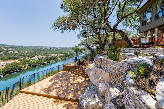 wooden deck with a water view