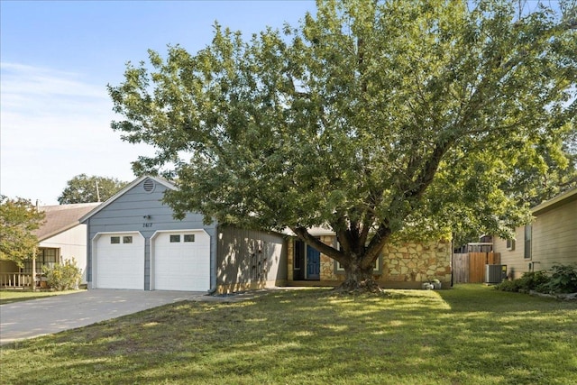 2612 Monarch Dr, Austin, TX 78748 - view of front of property with concrete driveway, an attached garage, and stone siding