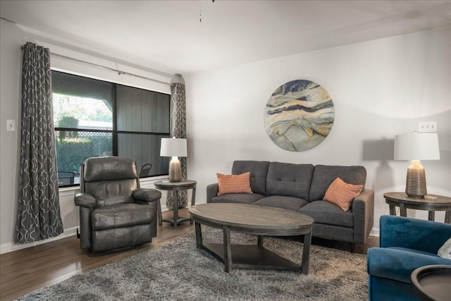 living area featuring wood finished floors and baseboards